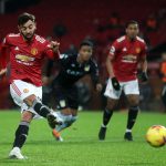 Manchester United caza al líder